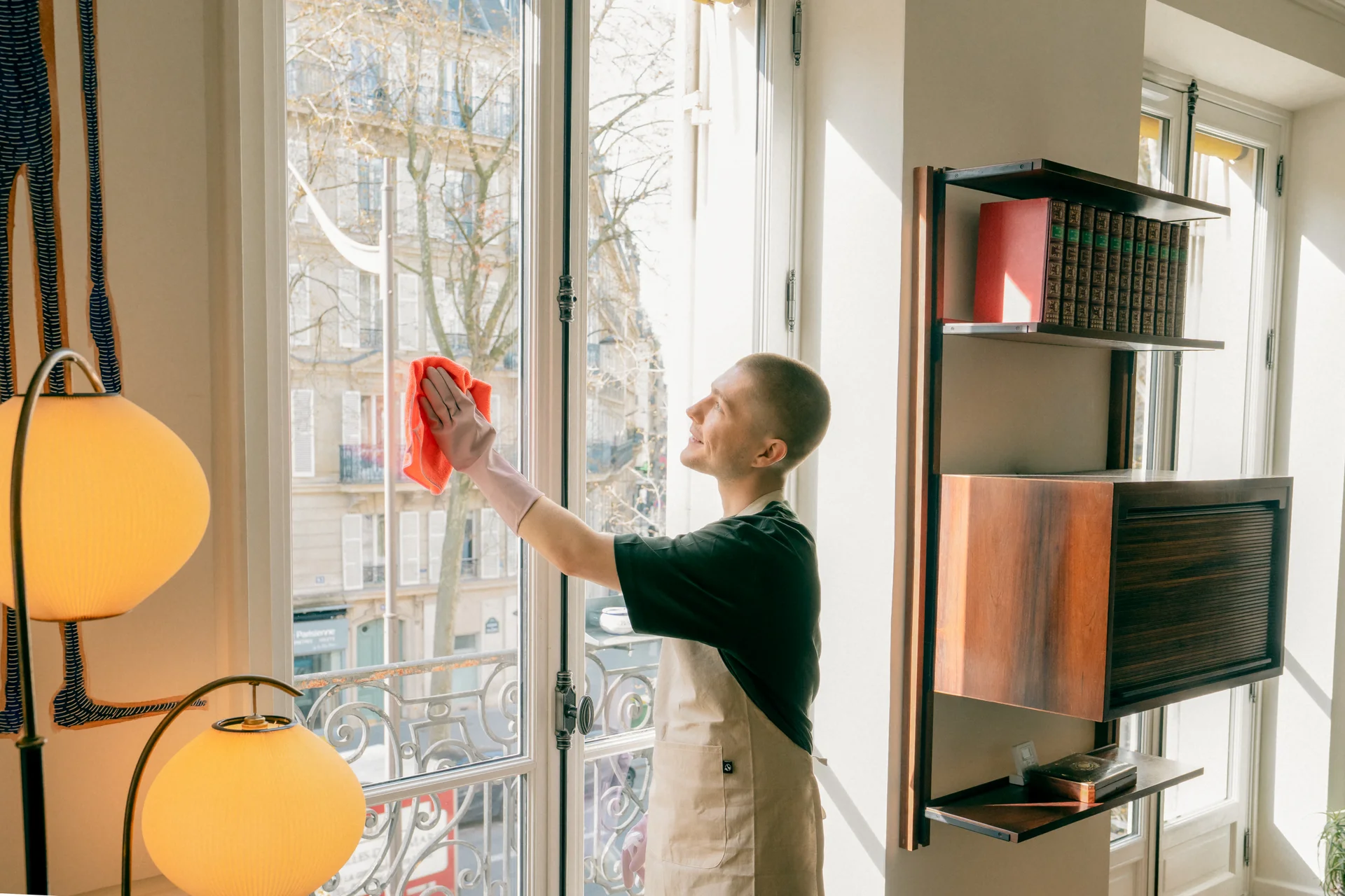 cocasian-man-cleaning-window